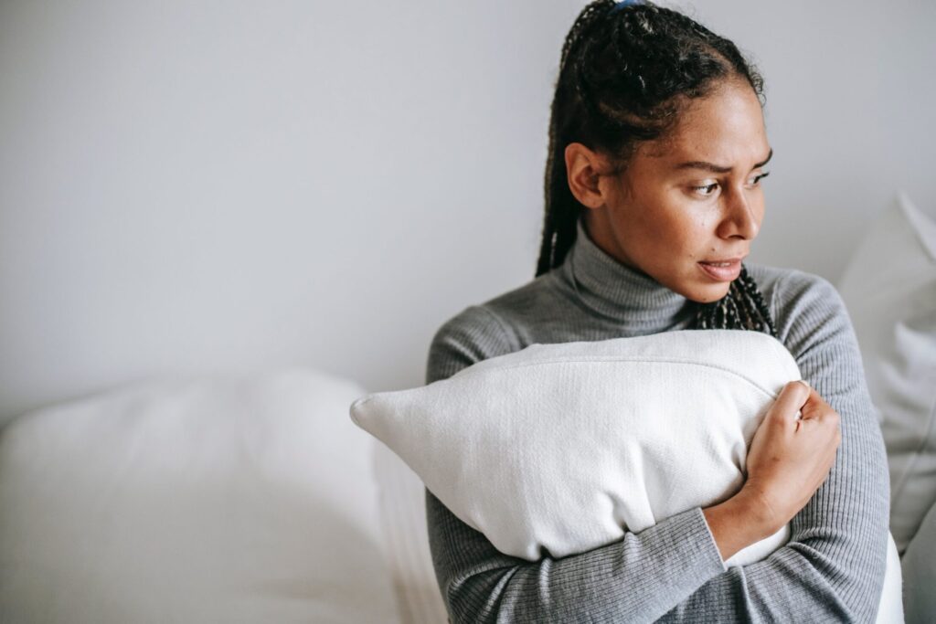 Worried Woman Holding a Pillow