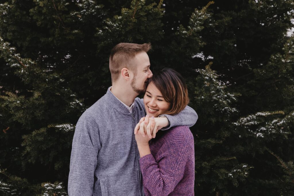 Couple hugging in the forest